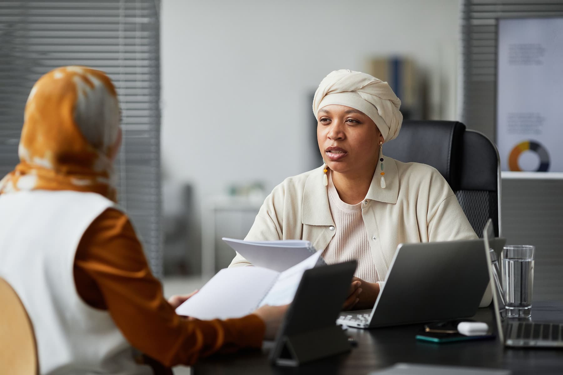 A person planning household finances at home in natural light